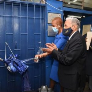 Education Minister Fayval Williams (left), cuts the ribbon to officially open the STEAM Lab hat was donated by Dr Joseph Tait, during a ceremony held at Jamaica College. Sharing the moment (from second left) are Dr Tait and Principal at Jamaica College, Wayne Robinson. 