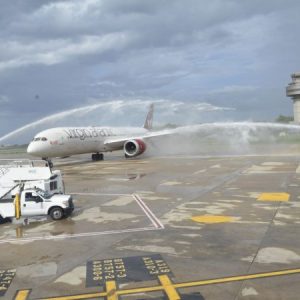The Virgin Atlantic plane carrying passengers and crew from London, England, taxis beneath the symbolic water salute at the Sangster International Airport in Montego Bay, St. James, as the airline resumed flights to the island on October 2. 